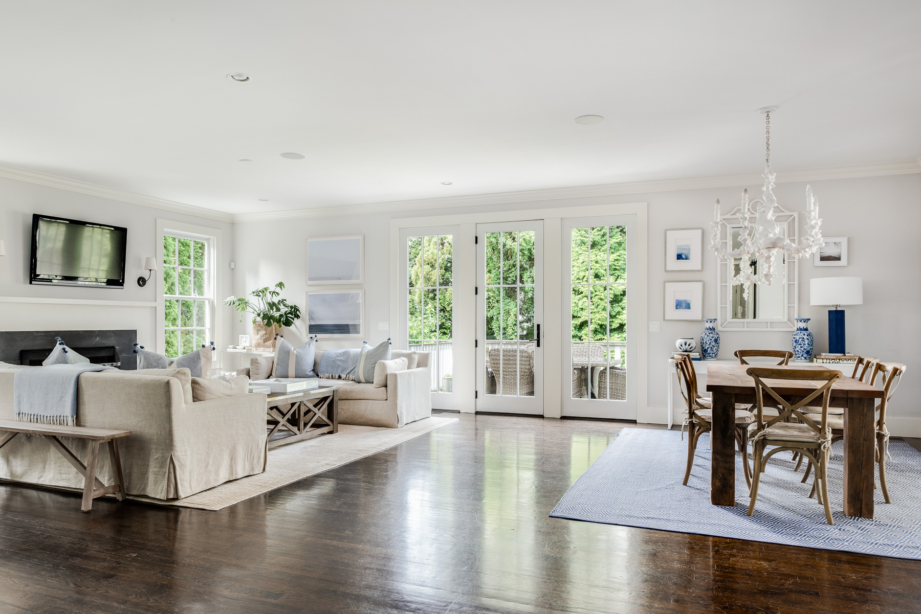 Open concept living and dining area with French doors